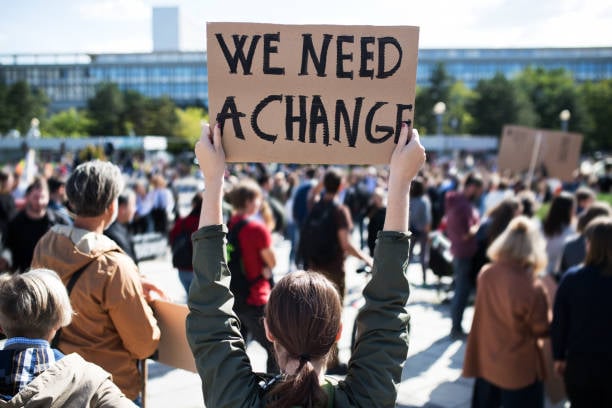 Protest sign calling for change
